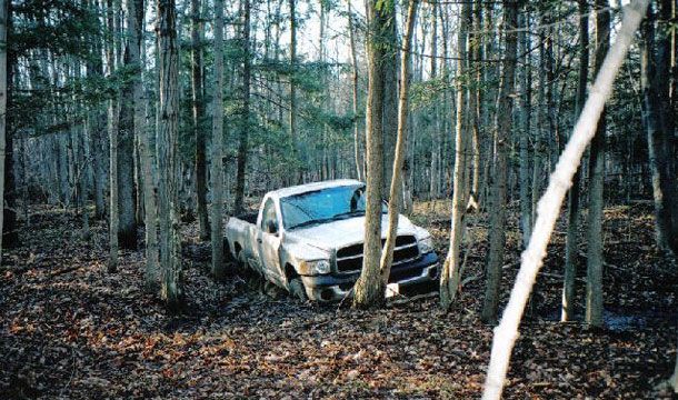 truck in muddy woods